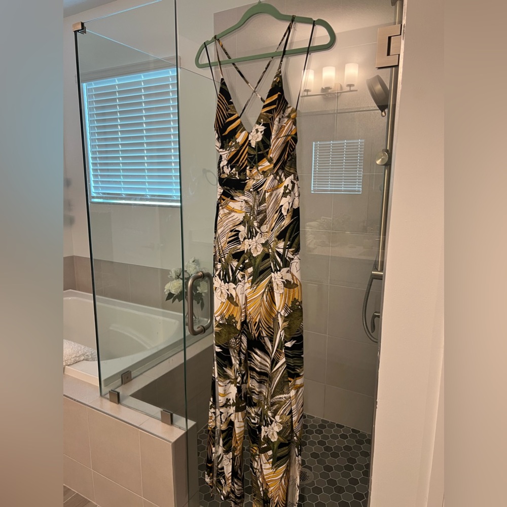 Jumpsuit with slits up leg shorts underneath and open back